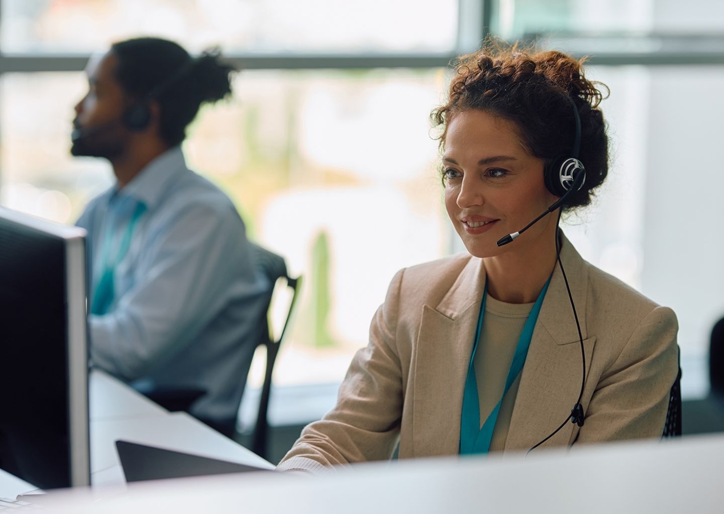 smiling-customer-service-representative-working-on-2026-03-16-03-27-57-utc.jpg