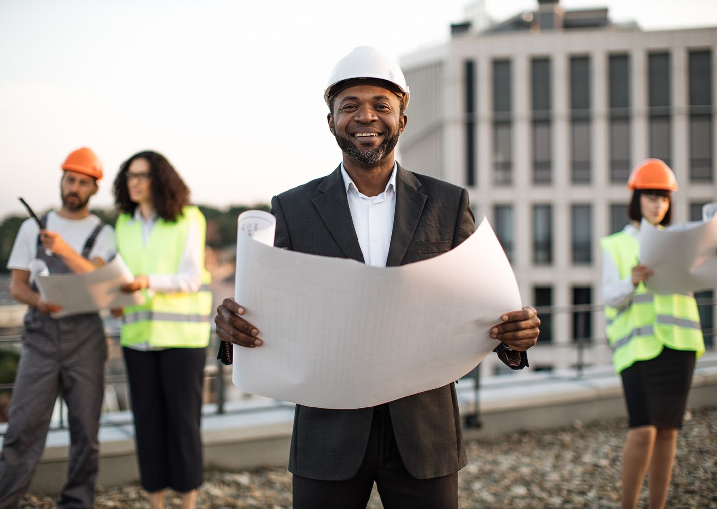 investor-posing-at-camera-while-colleagues-inspect-2024-12-13-12-23-49-utc.jpg