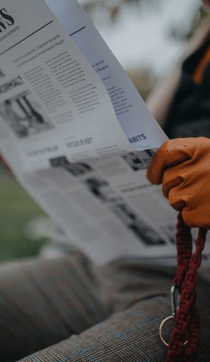senior-man-sitting-on-bench-and-reading-newspaper-2024-10-21-10-07-43-utc.jpg